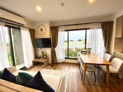 Modern living room with balcony view and stylish decor