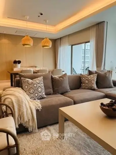 Luxurious living room with modern decor and elegant lighting in a high-end apartment.
