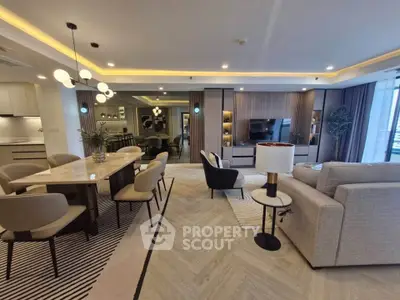 Luxurious open-plan living room with modern dining area and stylish decor