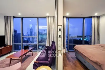 Luxurious modern apartment with stunning city view, featuring spacious living room and cozy bedroom.