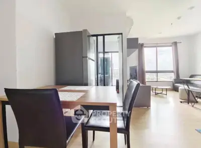 Modern open-plan living room with dining area and large window view