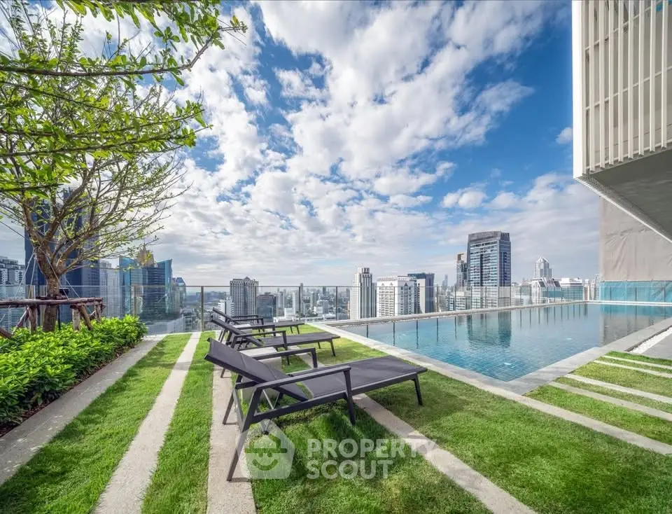 Luxurious rooftop pool with stunning city skyline views and modern lounge chairs.