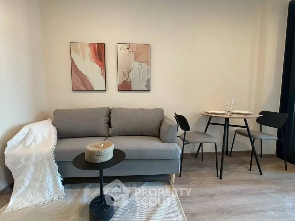 Cozy living room with modern decor and dining area, perfect for relaxation and entertaining.