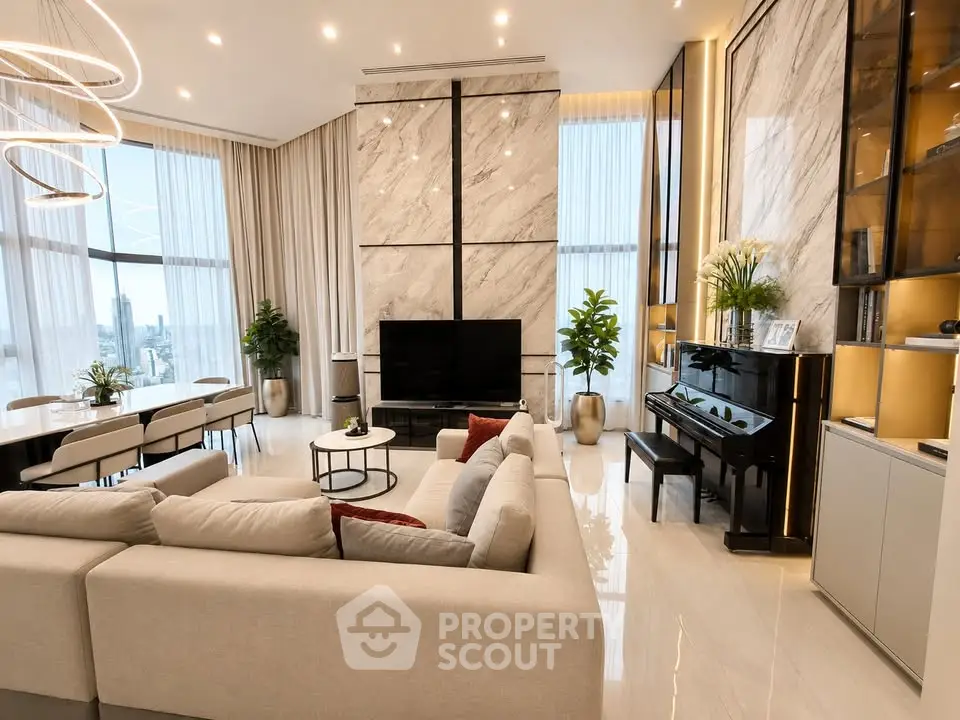Luxurious modern living room with high ceilings, elegant decor, and panoramic city views.