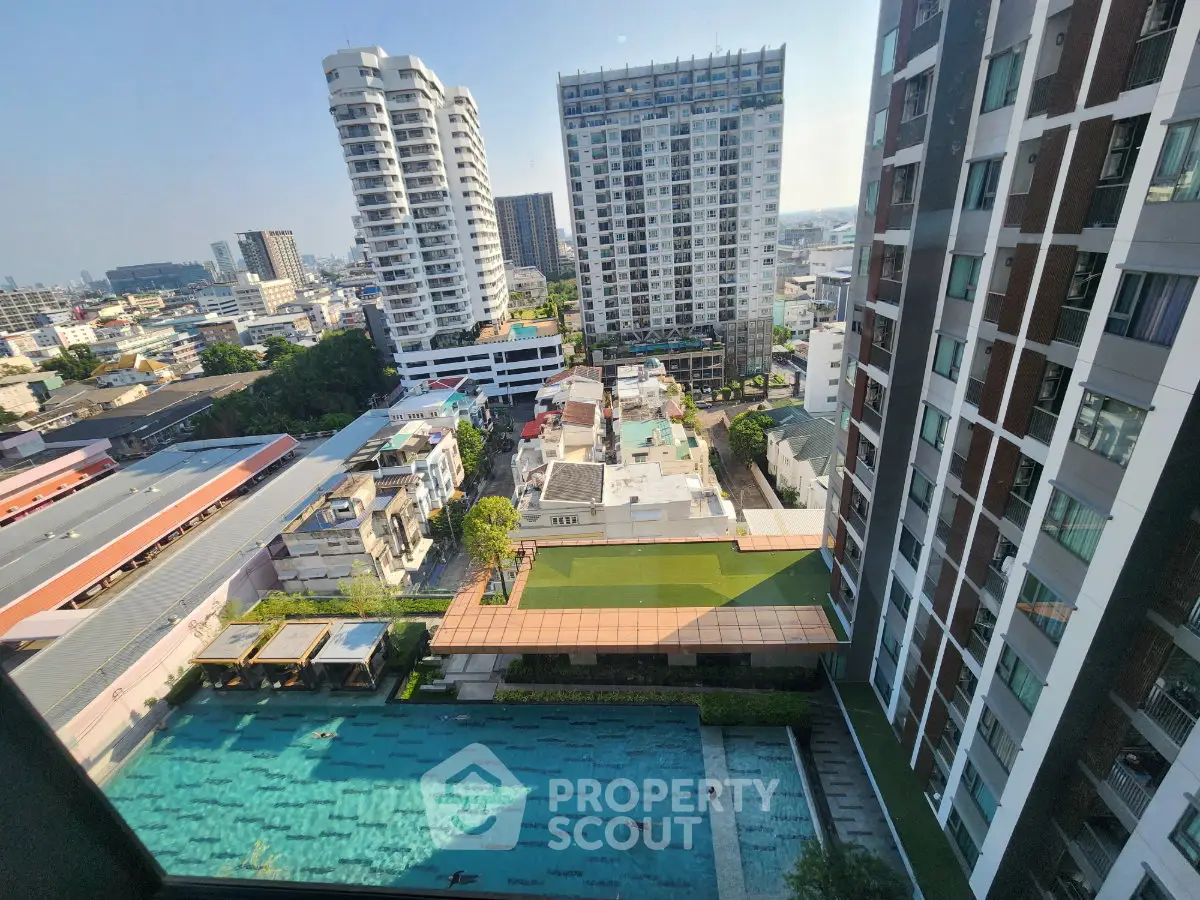 Stunning high-rise view with pool and cityscape, perfect for urban living.