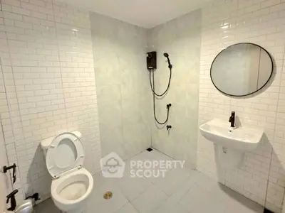 Modern bathroom with sleek fixtures and white subway tiles