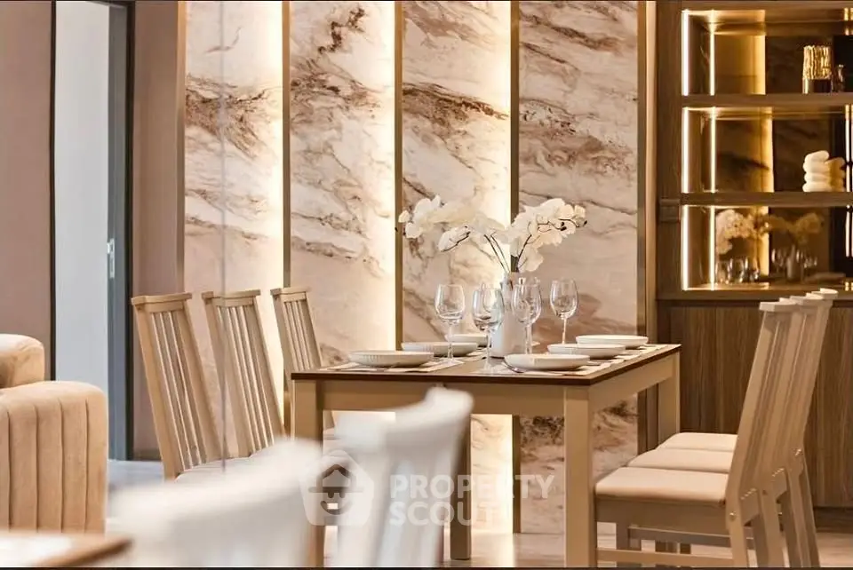 Elegant dining area with modern decor and ambient lighting, perfect for sophisticated gatherings.
