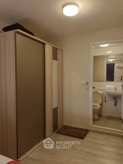 Cozy bedroom with ensuite bathroom and modern wardrobe