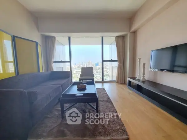 Spacious living room with stunning city view and modern furnishings