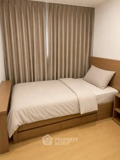 Cozy bedroom with wooden furniture and neutral curtains, perfect for restful nights.