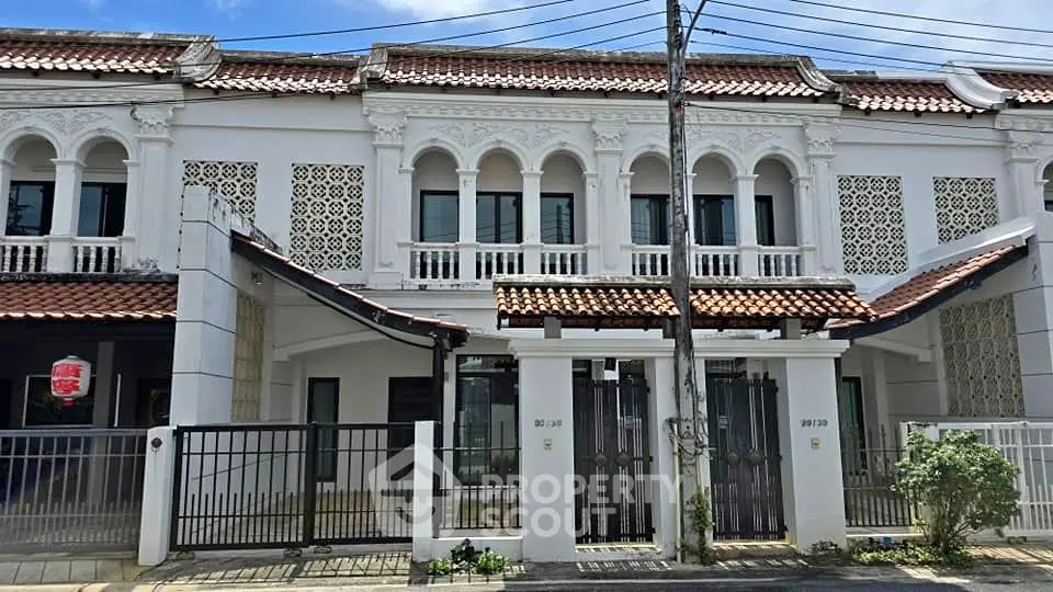 Charming heritage-style terrace house with intricate facade and classic architectural details.