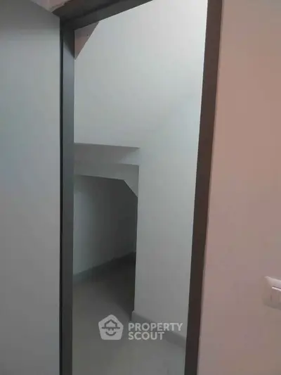 Compact storage space under stairs in modern home