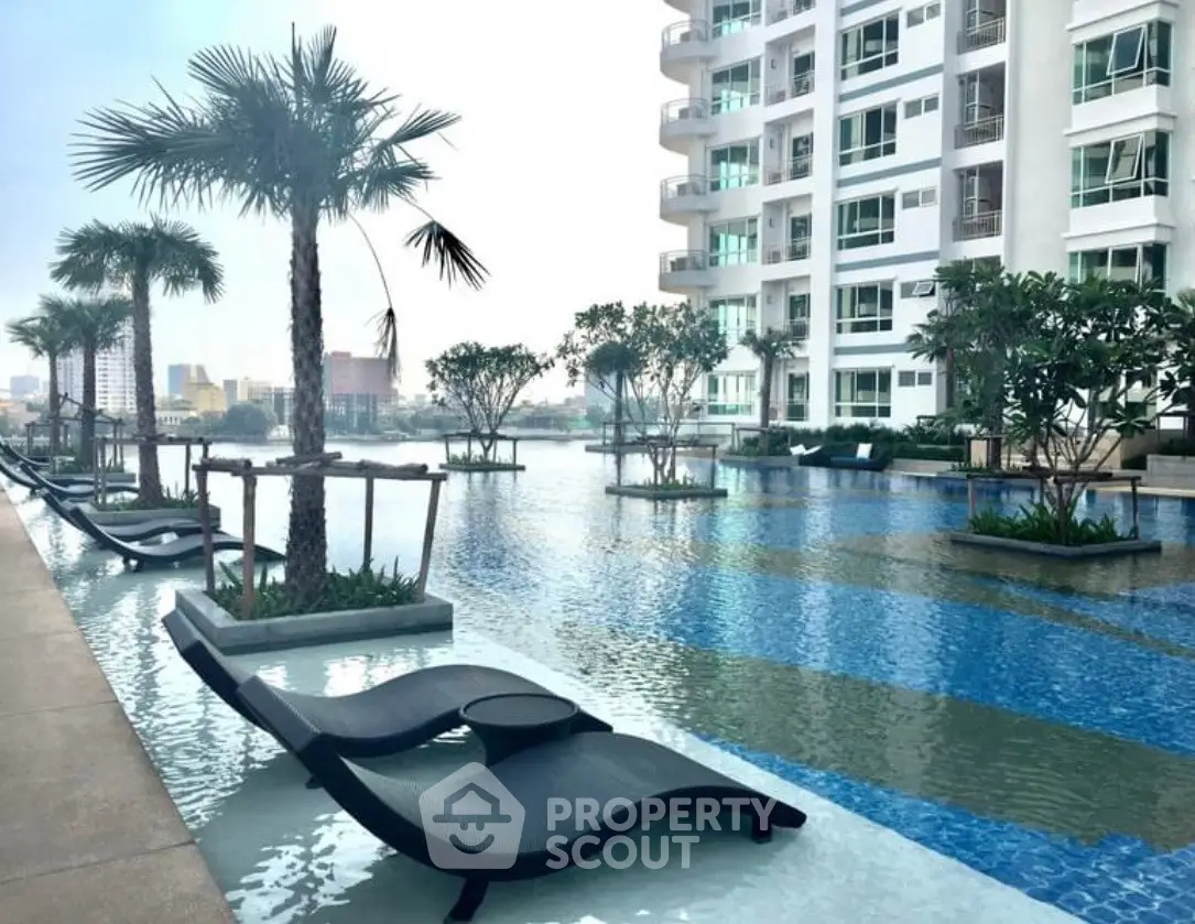 Luxurious condominium with stunning poolside view and modern amenities.
