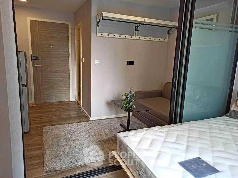 Modern studio apartment with cozy living area and stylish decor