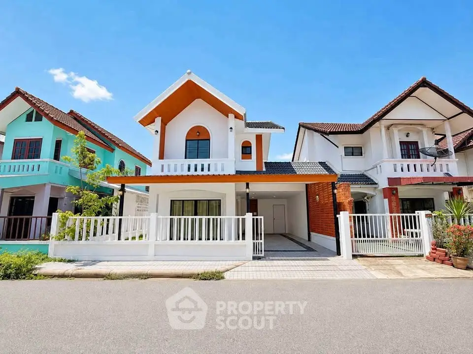 Charming suburban homes with unique architectural designs and vibrant colors under a clear blue sky.
