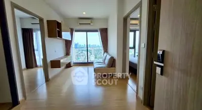 Spacious modern living room with city view and balcony access