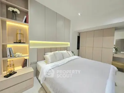 Modern bedroom with elegant built-in storage and ambient lighting