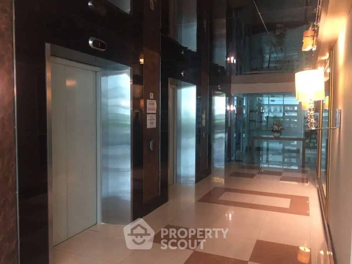 Modern building elevator lobby with sleek design and ambient lighting