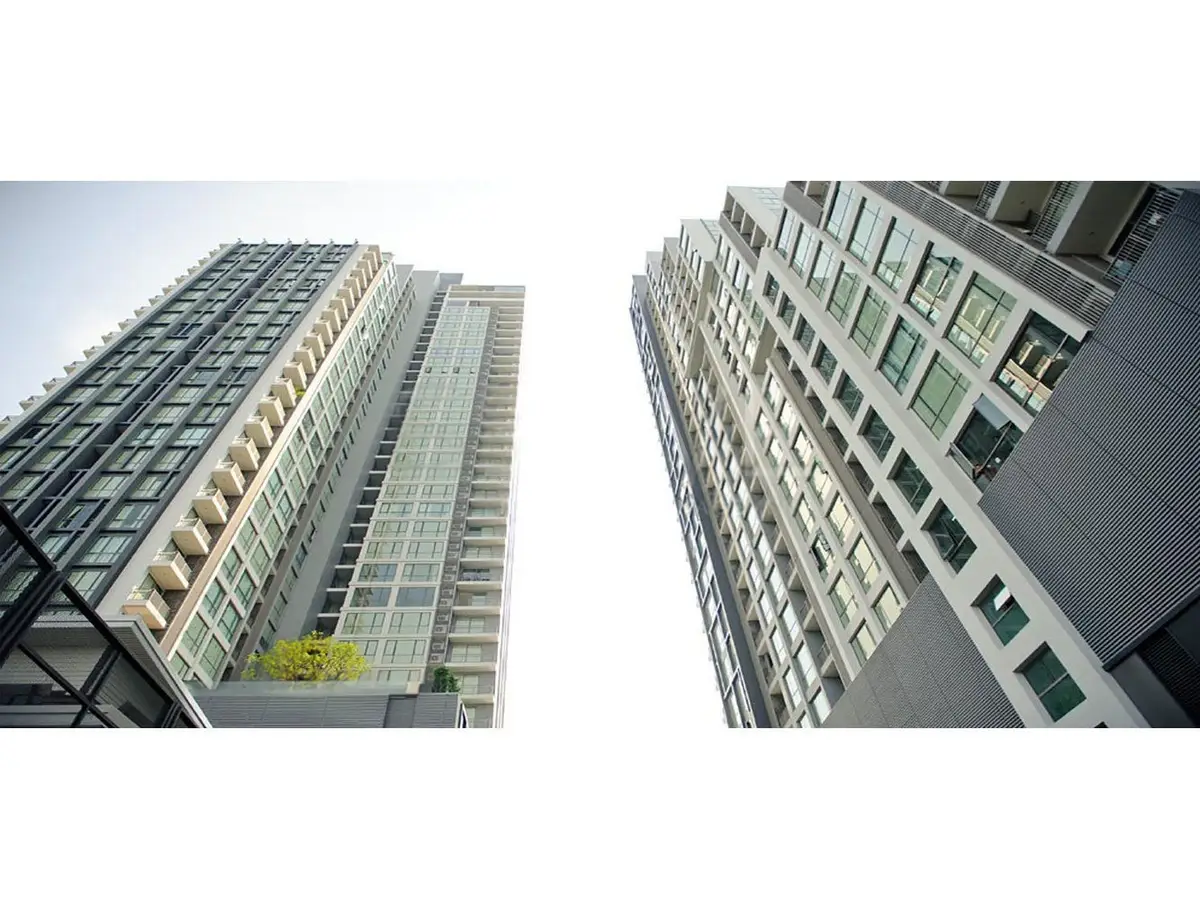 Stunning modern high-rise buildings with sleek glass facades and urban architectural design.