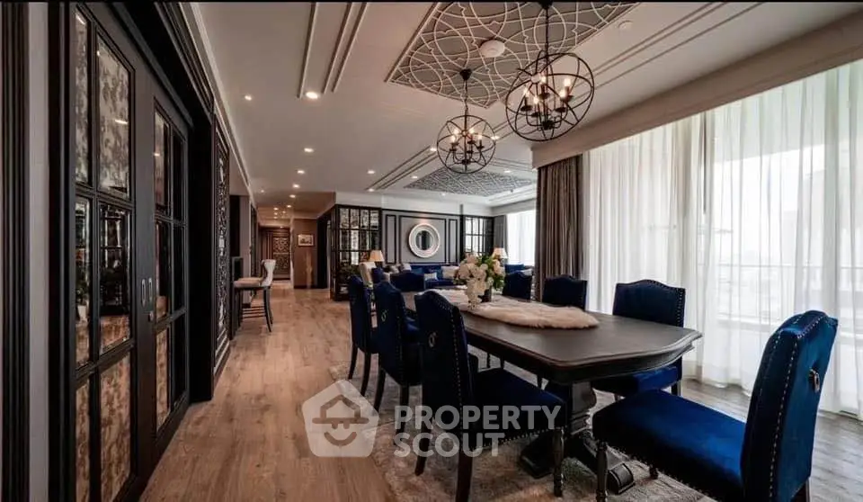 Luxurious dining room with elegant decor and modern lighting in a spacious apartment.