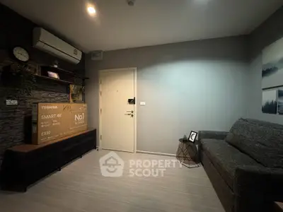 Modern living room with sleek design and new Toshiba Smart TV box, perfect for cozy evenings.
