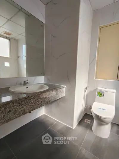 Modern bathroom with sleek design and granite countertop