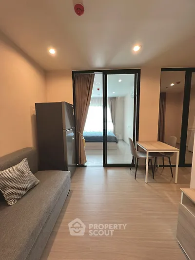 Modern apartment interior with cozy living room and bedroom view