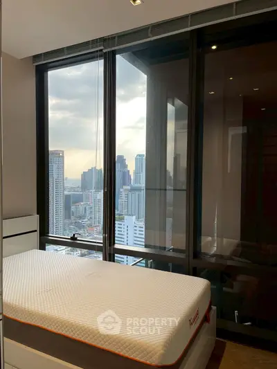 Modern bedroom with stunning city view and large windows