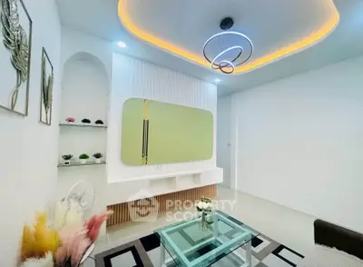 Modern living room with stylish ceiling lights and contemporary decor