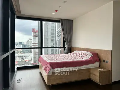 Modern bedroom with city view, large windows, and stylish wooden furniture.