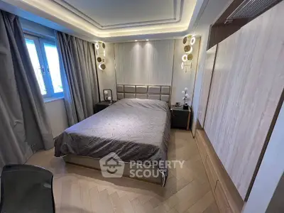 Luxurious modern bedroom with elegant lighting and stylish decor