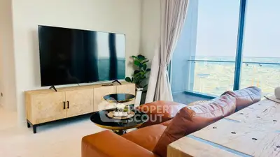 Luxurious living room with modern decor and stunning city view from large windows.