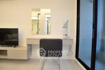 Modern living room with sleek TV setup and stylish desk area