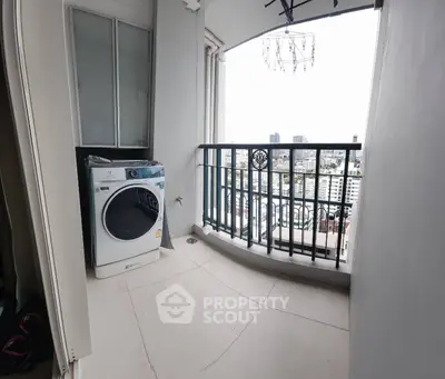 Charming balcony with city view and washing machine, perfect for urban living convenience.