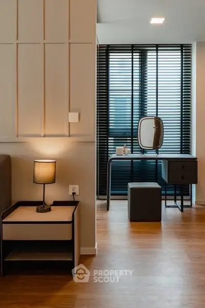 Modern bedroom with stylish decor and natural light