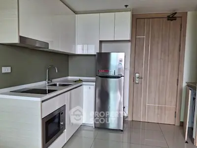 Modern kitchen with sleek cabinetry and stainless steel appliances