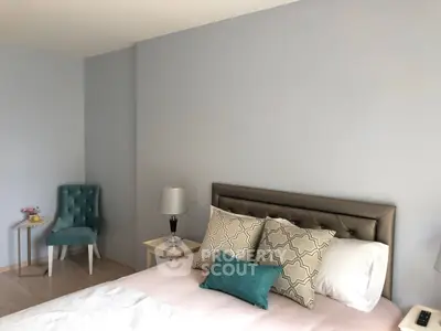 Elegant bedroom with stylish decor and plush bedding