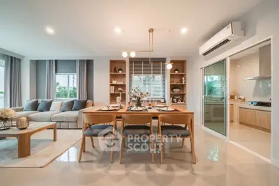 Spacious modern living and dining area with elegant decor and natural light.