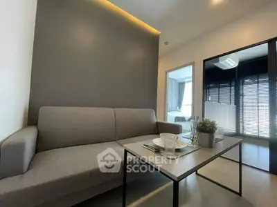 Modern living room with sleek gray sofa and stylish decor