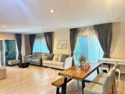 Spacious living room with elegant decor and natural light