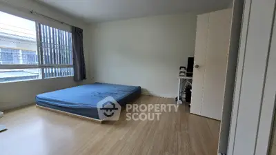 Spacious bedroom with natural light and minimalist design