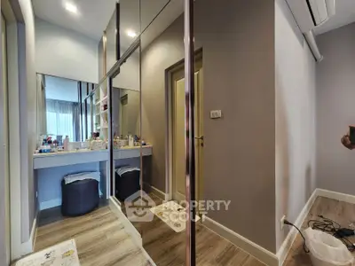 Modern bedroom with mirrored wardrobe and stylish decor