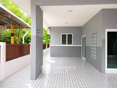 Spacious modern patio with sleek design and tiled flooring, perfect for outdoor relaxation.