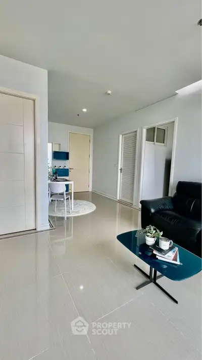 Modern living room with sleek furniture and open layout, perfect for contemporary living.