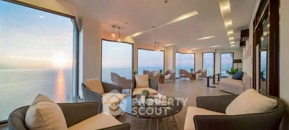 Luxurious living room with panoramic ocean views and elegant seating area.