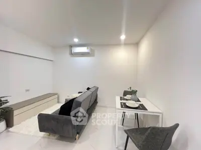 Modern minimalist living room with sleek furniture and bright lighting