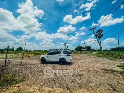 Expansive land plot with clear skies, ideal for development opportunities.