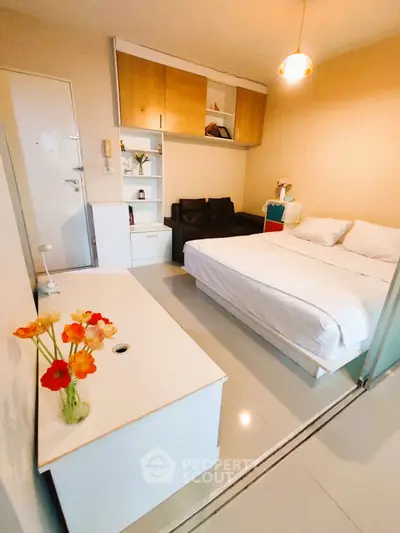 Cozy modern bedroom with sleek design and ample storage, perfect for urban living.