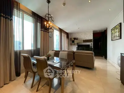Luxurious living room with elegant dining area and modern decor in a high-rise apartment.