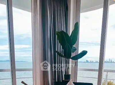 Luxurious living room with stunning ocean view and elegant decor